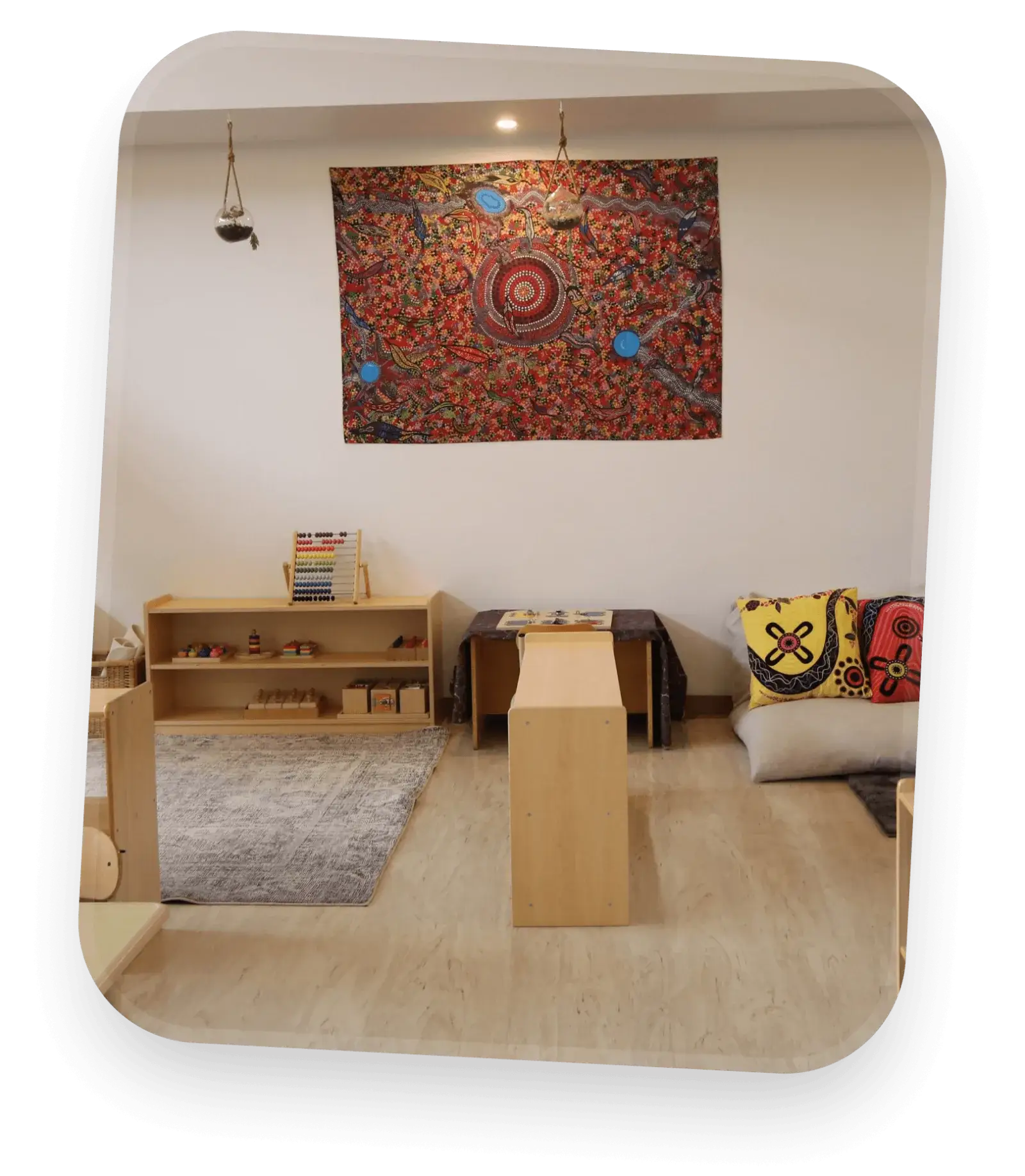 A Montessori room with low wooden shelves